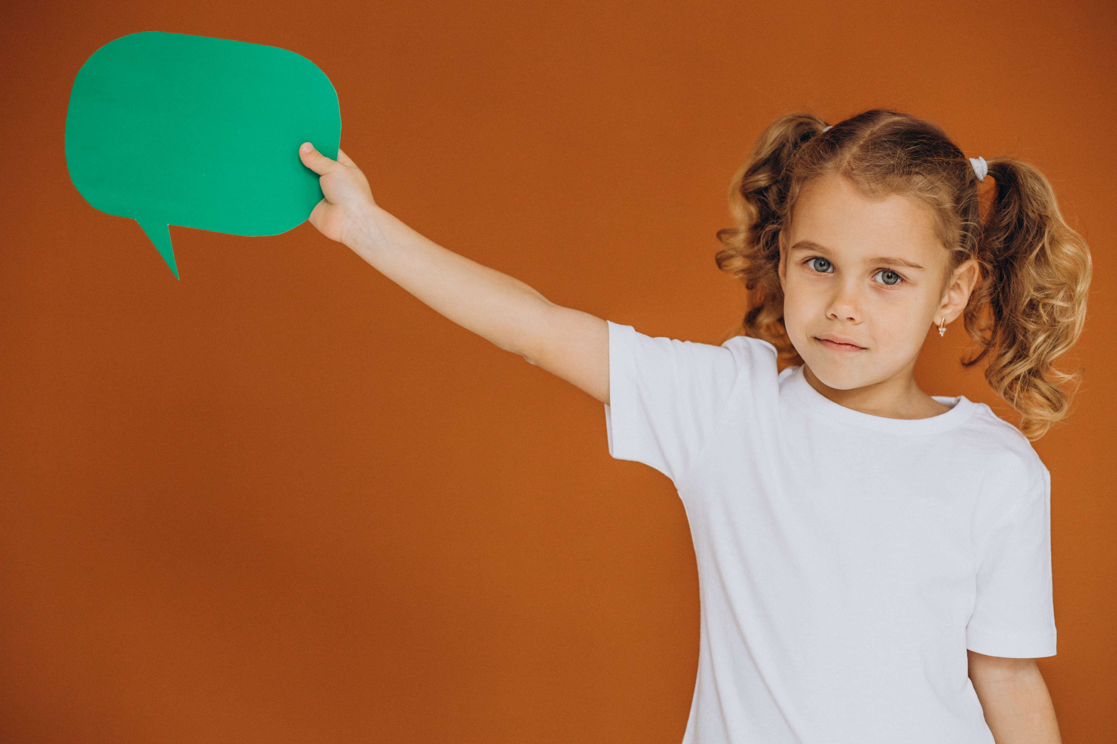 cute-little-girl-holding-mind-bubbles-isolated-studio
